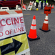 A sign directing people to a covid-19 vaccination clinic held at Dodgers Stadium in Los Angeles this past January.
